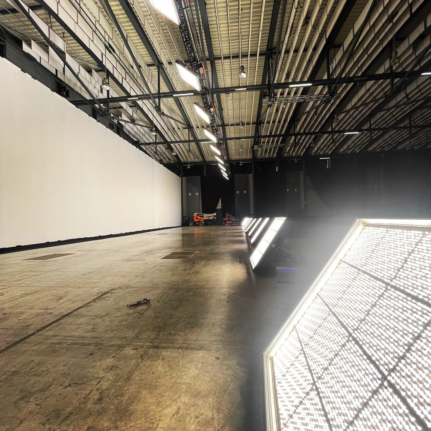 Empty warehouse stage with a large softbox laid on the floor